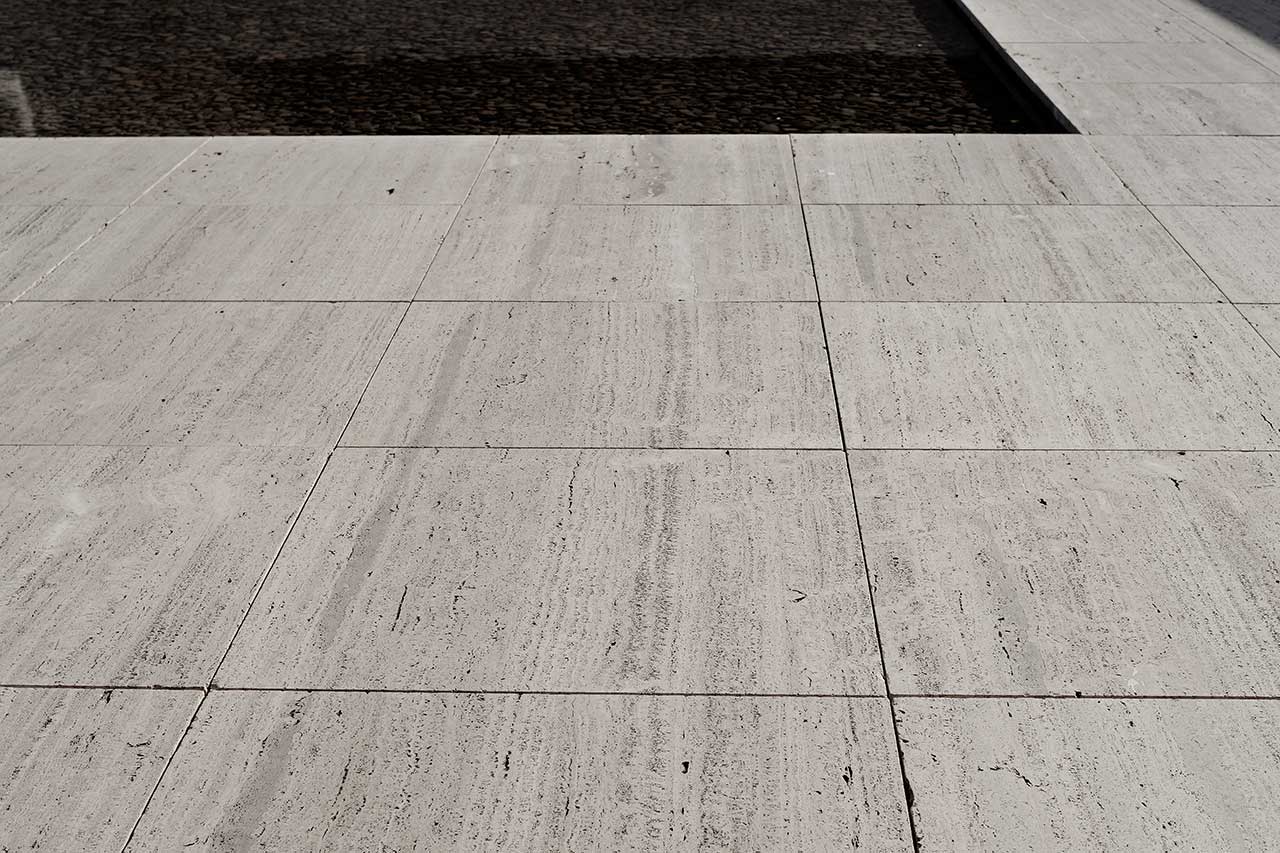 close up of travertine pavers in walkway