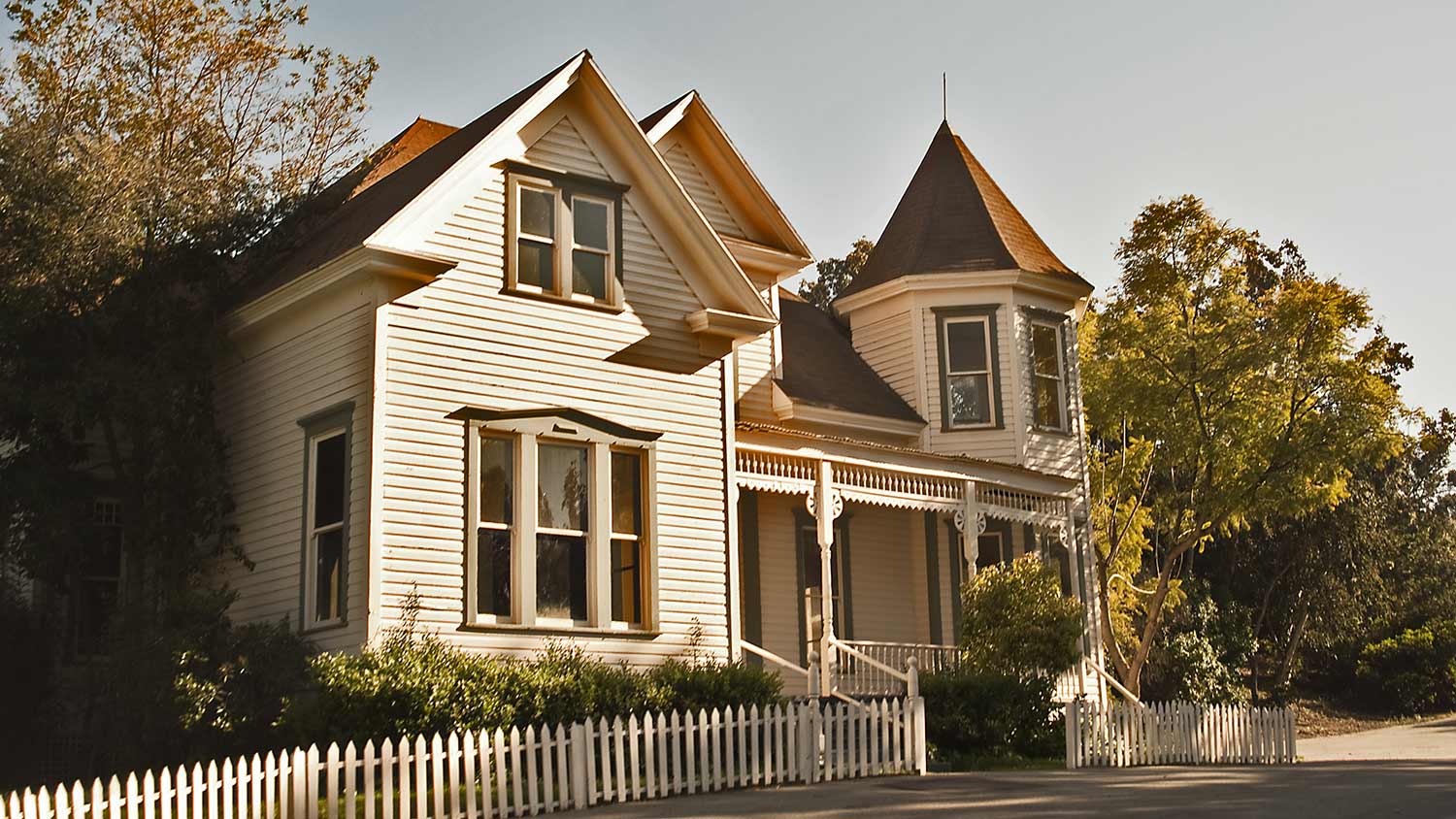 A historic home with picket fence