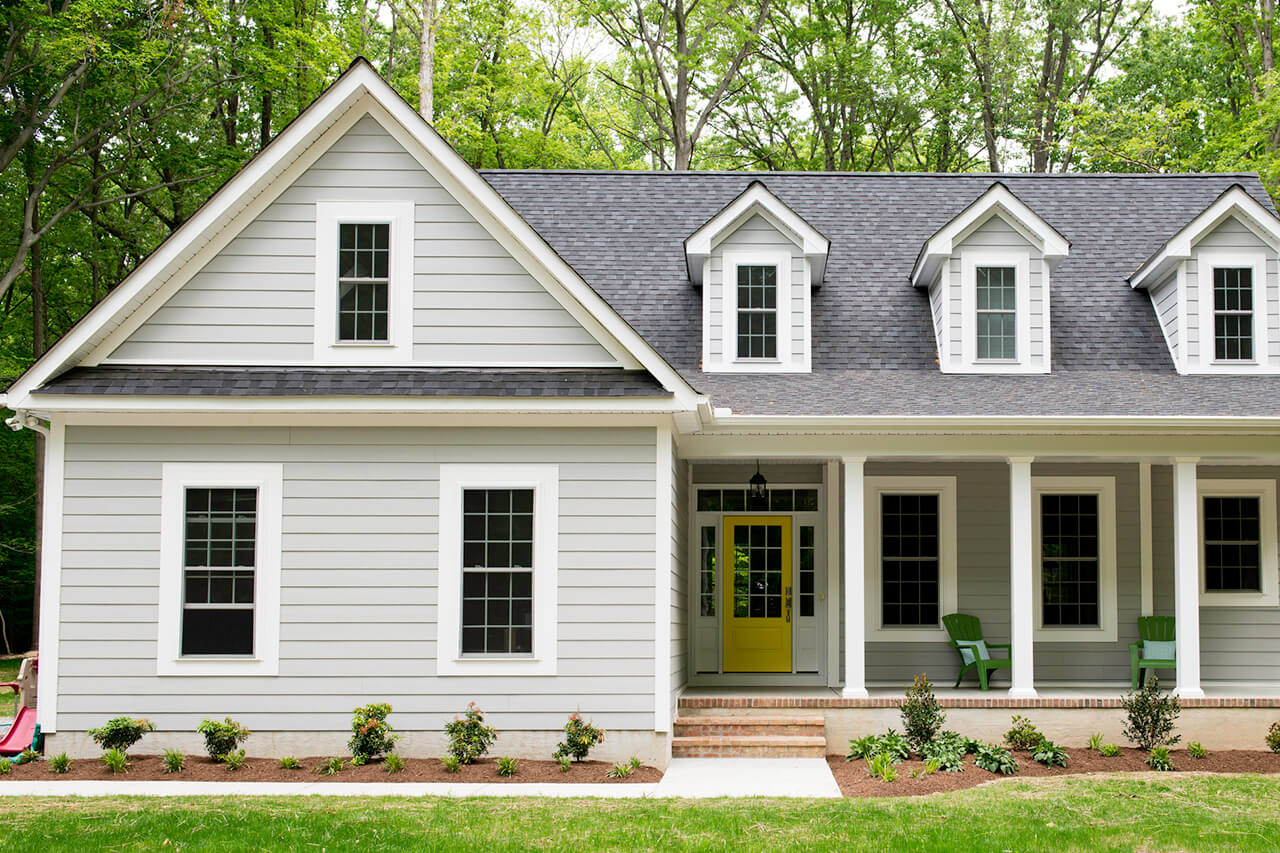 Exterior of newly built suburban house with trees
