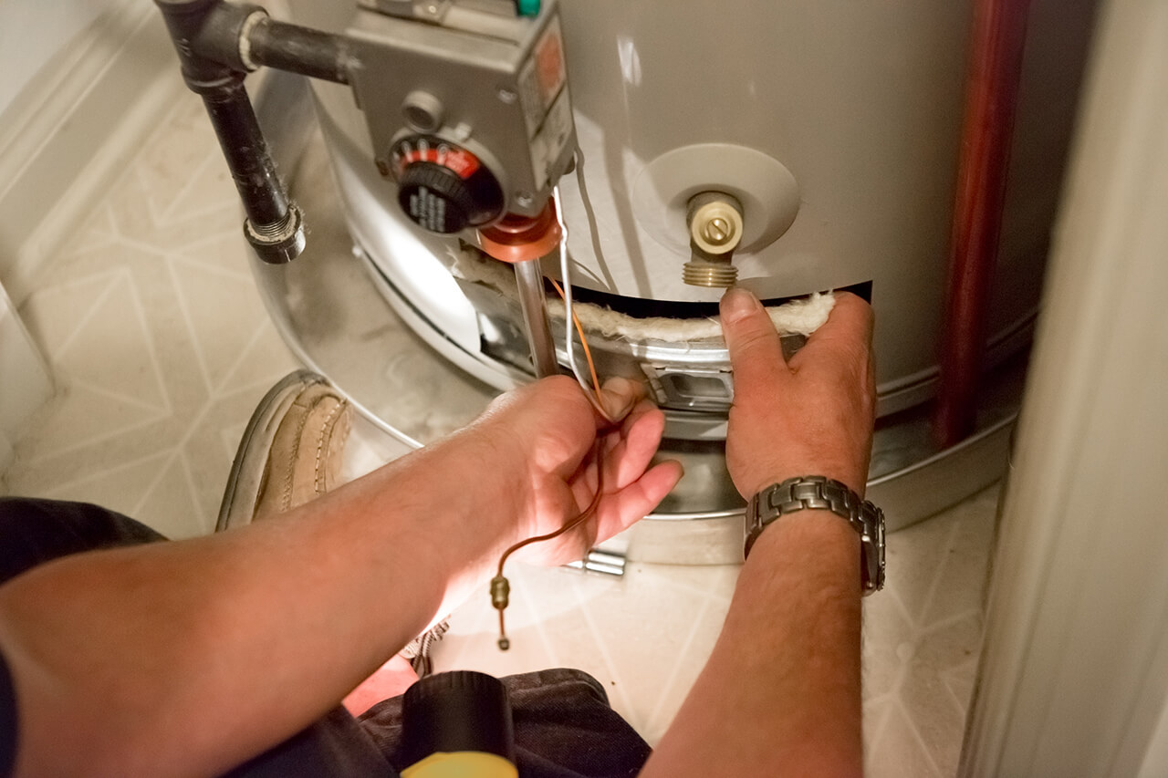 plumber repairing a water heater