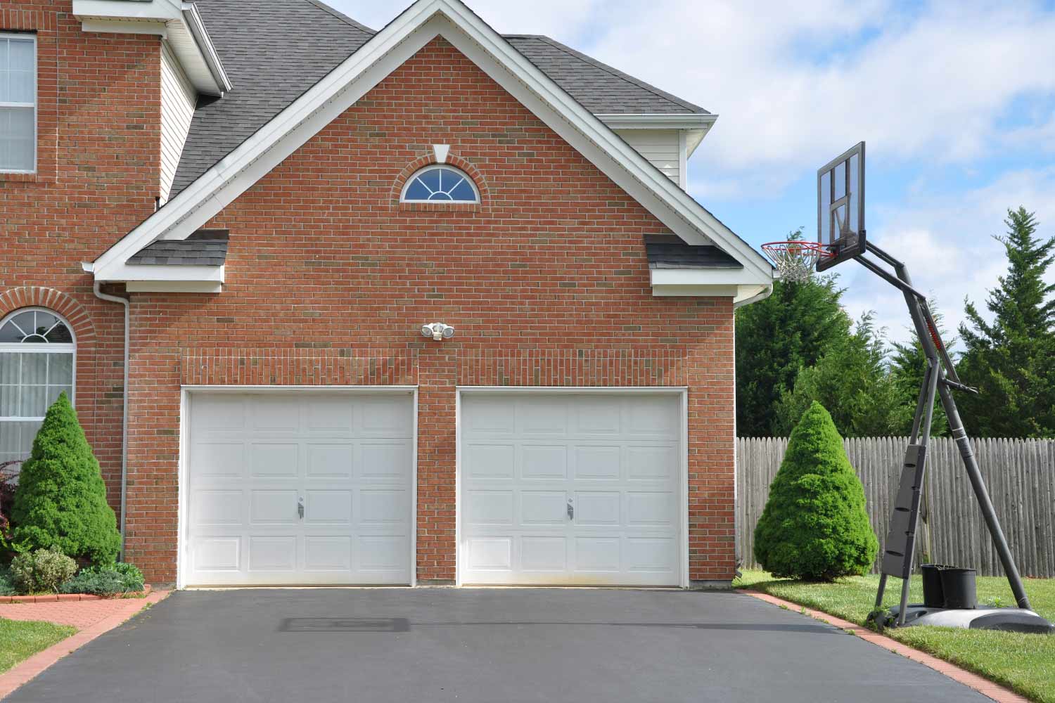 portable basketball hoop in driveway